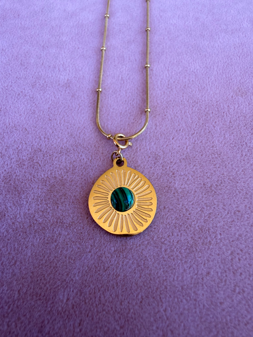 Gold Sunburst Disc Pendant Necklace with Green Stone Center